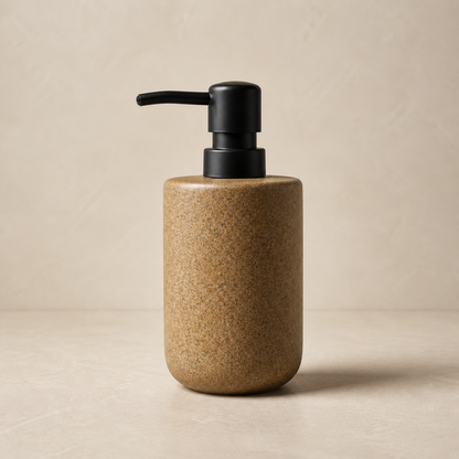 Ceramic hand soap dispenser in warm neutral studio setting