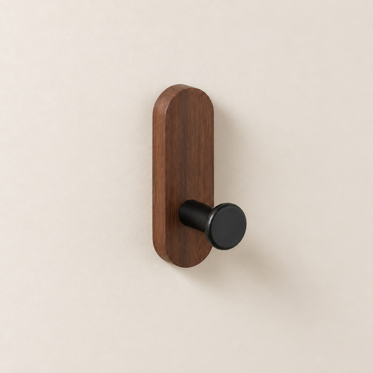Single walnut wood self-adhesive wall hook with matte black peg