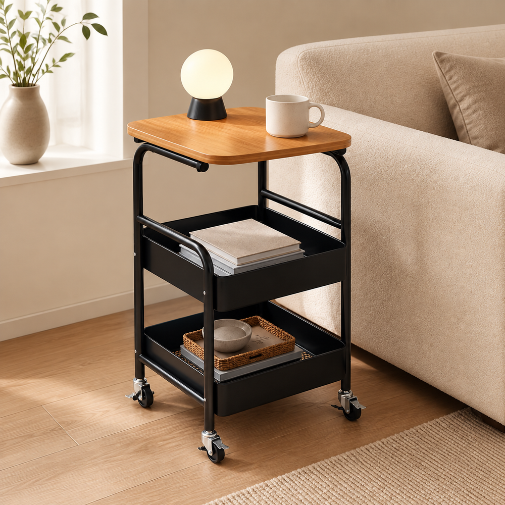 Black three-tier rolling cart with bamboo tabletop in a warm living room