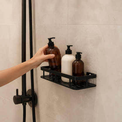 Black no-drill shower caddy installed in a shower