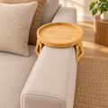 Bamboo Sofa Arm Tray mounted along the side armrest with both adjustable grips visible