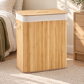 Natural bamboo laundry hamper with lid in a warm neutral bedroom